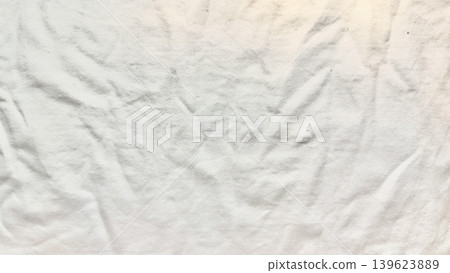 crumpled white fabric texture in serene closeup with soft natural wrinkles and delicate folds crumpled white fabric texture in serene closeup with soft natural wrinkles and delicate folds 139623889