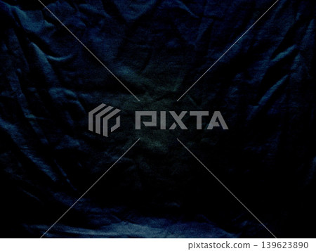 crumpled deep navy velvet fabric folds create dramatic chiaroscuro shadows in intimate abstract macro texture crumpled deep navy velvet fabric folds create dramatic chiaroscuro shadows in intimate abstract macro texture 139623890