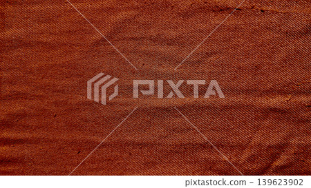terracotta woven denim fabric macro texture closeup with intricate threads and natural creases in rustic earthy tones terracotta woven denim fabric macro texture closeup with intricate threads and natural creases in rustic earthy tones 139623902