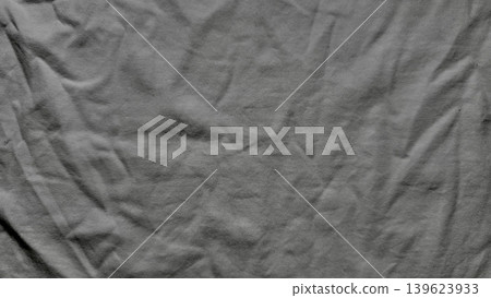 wrinkled fabric texture reveals intricate creases with dramatic shadows in abstract monochrome macro closeup 139623933