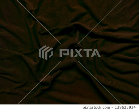 crumpled dark brown velvet fabric with deep folds and luxurious tactile wrinkles in dramatic light crumpled dark brown velvet fabric with deep folds and luxurious tactile wrinkles in dramatic light 139623934