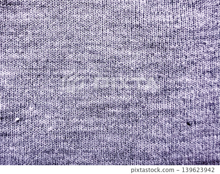 lavender knitted fabric texture macro revealing intricate stitches and subtle specks in cozy authentic tactile detail lavender knitted fabric texture macro revealing intricate stitches and subtle specks in cozy authentic tactile detail 139623942