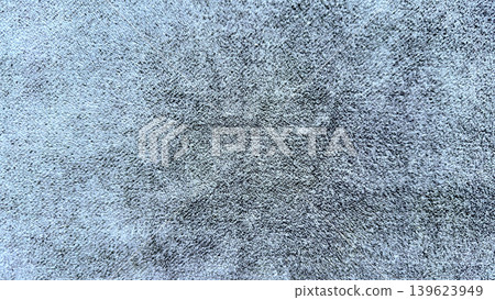 plush blue gray shaggy carpet macro texture closeup featuring central darker star pattern in soft natural light plush blue gray shaggy carpet macro texture closeup featuring central darker star pattern in soft natural light 139623949
