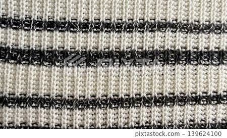 black and white striped knitted fabric texture closeup with cozy yarn stitch detail black and white striped knitted fabric texture closeup with cozy yarn stitch detail 139624100