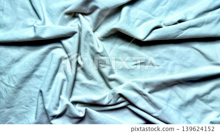 crumpled white fabric texture flows into serene minimalist folds with soft natural shadows crumpled white fabric texture flows into serene minimalist folds with soft natural shadows 139624152