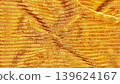 mesmerizing golden sand ripples undulate across serene desert landscape in warm hues 139624167