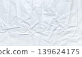 crumpled white paper texture with intricate organic folds casting soft shadows in serene minimalist abstract composition 139624175