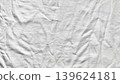 crumpled white fabric texture with intricate folds and soft dramatic shadows in abstract minimalist composition 139624181
