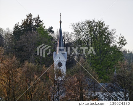 Serene Village Church Featuring Aged Mosscovered Roof And Seasonal Renovation Work By Community Workers 139624380