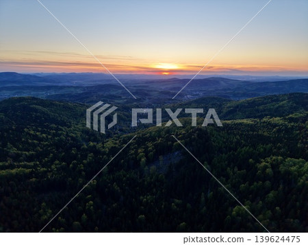 Evening Horizon With Silhouette. Silhouettes And Warm Tones Paint Tranquil Valley Scene At Sunset 139624475