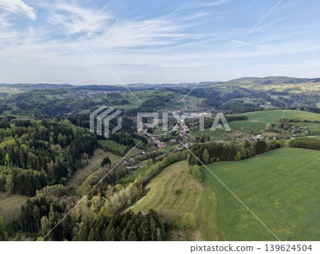 Vast Pastoral Landscape. Sprawling Green Meadows Stretch Into Distant Horizons Under Soft Sunlight Vast Pastoral Landscape. Sprawling Green Meadows Stretch Into Distant Horizons Under Soft Sunlight 139624504