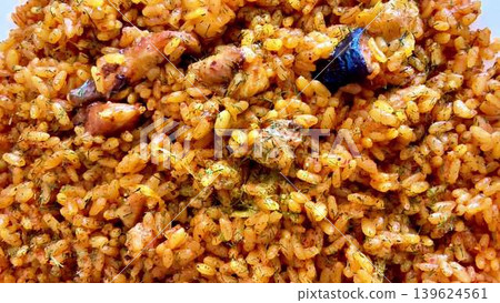 Delicious Nigerian Jollof Rice prepared with fresh Vegetables and tender Chicken pieces Delicious Nigerian Jollof Rice prepared with fresh Vegetables and tender Chicken pieces 139624561