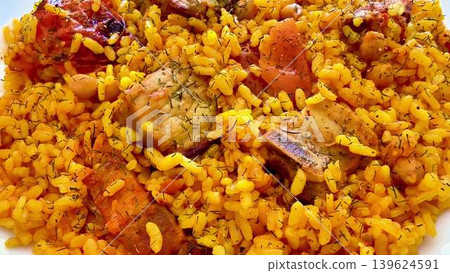This is a delicious and flavorful rice dish that comes loaded with juicy meat and fresh vegetables 139624591