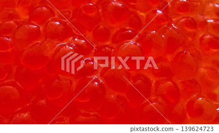 Vibrant Salmon Roe delicately presented on a beautifully crafted plate a true culinary delicacy 139624723