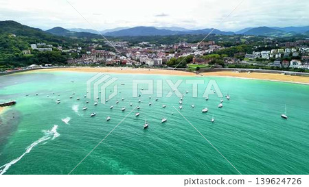 An Aerial View of Stunning Coastal Landscapes Featuring Boats, Hills, and Natural Beauty An Aerial View of Stunning Coastal Landscapes Featuring Boats, Hills, and Natural Beauty 139624726
