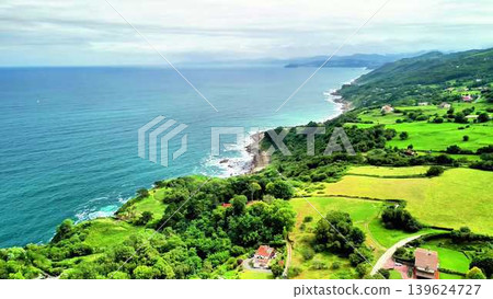 Experience Stunning Aerial Views Showcasing a Lush Coastal Landscape and a Tranquil Ocean Experience Stunning Aerial Views Showcasing a Lush Coastal Landscape and a Tranquil Ocean 139624727