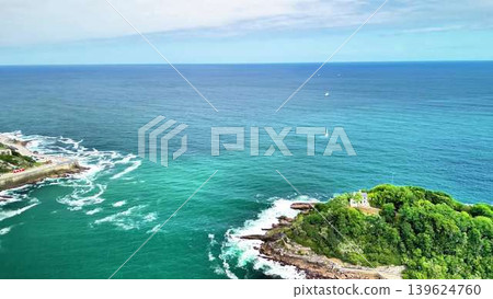 A Captivating Aerial View of a Beautiful Scenic Coastal Island Surrounded by Turquoise Waters A Captivating Aerial View of a Beautiful Scenic Coastal Island Surrounded by Turquoise Waters 139624760