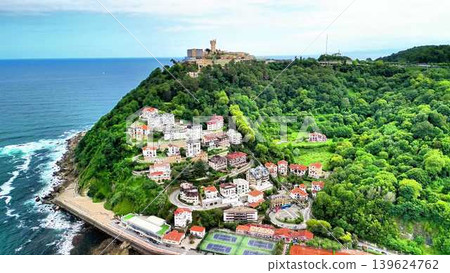 A Coastal Village Overlooking the Beautiful Ocean and Lush, Verdant Greenery Surrounding It A Coastal Village Overlooking the Beautiful Ocean and Lush, Verdant Greenery Surrounding It 139624762