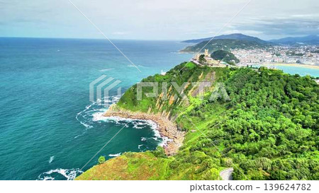 Experience the Stunning Aerial View of a Coastal Landscape adorned with Lush Greenery Experience the Stunning Aerial View of a Coastal Landscape adorned with Lush Greenery 139624782