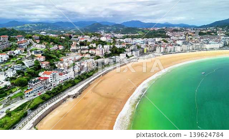 Stunning and breathtaking Aerial View of a Coastal City featuring a Beautiful Beach Stunning and breathtaking Aerial View of a Coastal City featuring a Beautiful Beach 139624784