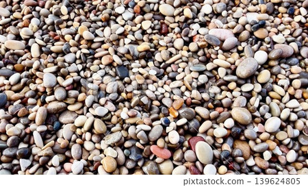 A beautiful and serene Pebble Beach, featuring gentle waves and enchanting clear water A beautiful and serene Pebble Beach, featuring gentle waves and enchanting clear water 139624805