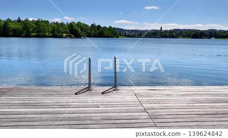Experience the serene and picturesque Lakeside View featuring a Docking Area with Calm Waters Experience the serene and picturesque Lakeside View featuring a Docking Area with Calm Waters 139624842