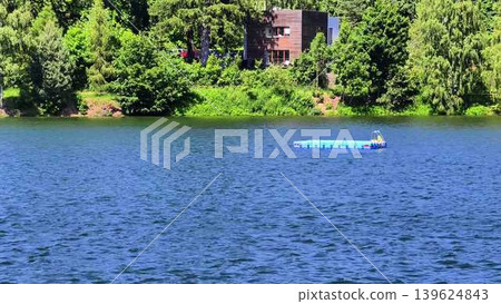 Enjoy the Serene and Beautiful Lakeside Views Surrounded by Lush Greenery for Relaxation Enjoy the Serene and Beautiful Lakeside Views Surrounded by Lush Greenery for Relaxation 139624843