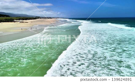 Stunning Aerial View of Serene Beach with Waves Gently Lapping Against the Golden Sand Stunning Aerial View of Serene Beach with Waves Gently Lapping Against the Golden Sand 139624891