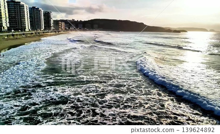 The Serene Ocean Waves are Gently Caressing the Shoreline During a Beautiful Sunset Time Frame The Serene Ocean Waves are Gently Caressing the Shoreline During a Beautiful Sunset Time Frame 139624892