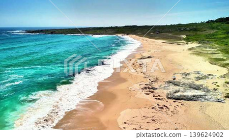 Experience the stunning beach view with turquoise waters and soft sandy shores for a perfect escape 139624902
