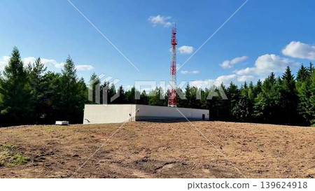 Telecommunication Tower Surrounded by a Vast Forest Landscape with Diverse Ecosystem Features Telecommunication Tower Surrounded by a Vast Forest Landscape with Diverse Ecosystem Features 139624918