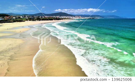 Experience the Stunning Coastal View featuring Vibrant Waves and Serene, Peaceful Sands Experience the Stunning Coastal View featuring Vibrant Waves and Serene, Peaceful Sands 139625006