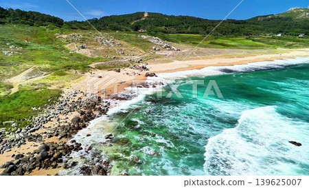 Stunning Aerial View of a Serene Coastal Beach with Beautifully Clear Turquoise Waters Stunning Aerial View of a Serene Coastal Beach with Beautifully Clear Turquoise Waters 139625007