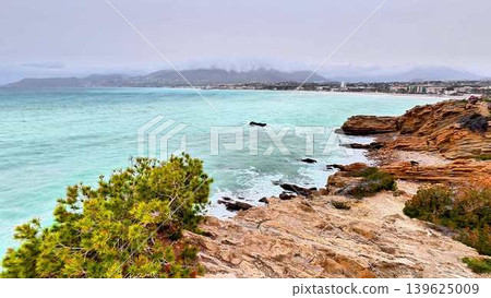 Breathtaking Scenic Coastline View Featuring Turquoise Waters and Majestic Rocky Cliffs 139625009