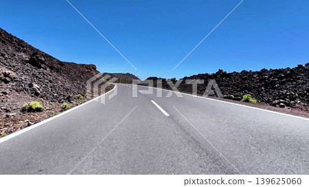Experience the stunning scenic road that winds through the breathtaking volcanic landscape Experience the stunning scenic road that winds through the breathtaking volcanic landscape 139625060
