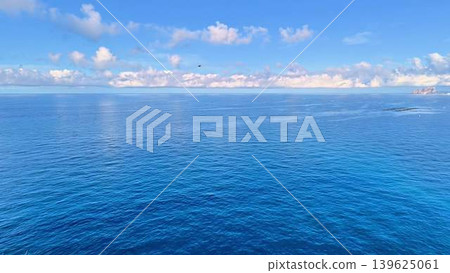 Enjoy a Serene Ocean View with Clear Blue Skies and Gentle Waves that inspire tranquility 139625061