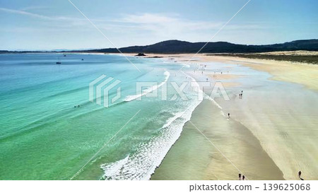 Stunning Aerial View of a Picturesque Tropical Beach with Clear Blue Water and Fine Sand Stunning Aerial View of a Picturesque Tropical Beach with Clear Blue Water and Fine Sand 139625068