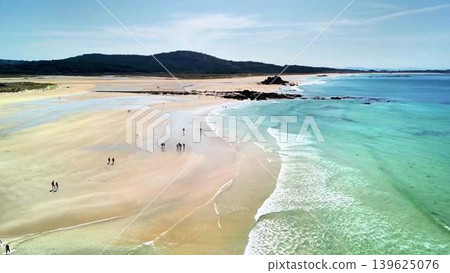 Stunning Aerial View of a Serene, Beautiful Beach Featuring Crystal Clear Waters with Soft Sand 139625076