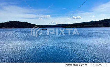 A Beautiful and Tranquil Lake Landscape Under Clear and Bright Blue Skies Awaits You A Beautiful and Tranquil Lake Landscape Under Clear and Bright Blue Skies Awaits You 139625195