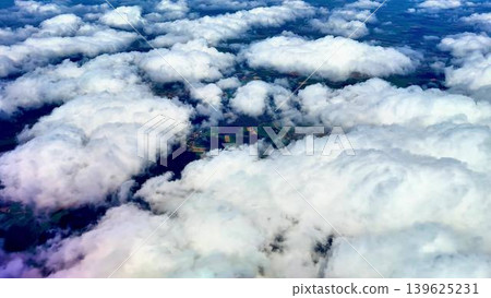 A Stunning Aerial View of Fluffy White Clouds Gracefully Floating Above Expansive Green Fields A Stunning Aerial View of Fluffy White Clouds Gracefully Floating Above Expansive Green Fields 139625231