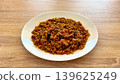 A delicious and spicy Jollof Rice dish featuring a mix of vibrant vegetables and tender chicken 139625249