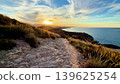 Experience a Serene Coastal Sunset A Scenic Path to Explore by the Beautiful Ocean 139625254