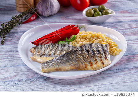 Grilled seabass fillet with ptitim 139625374