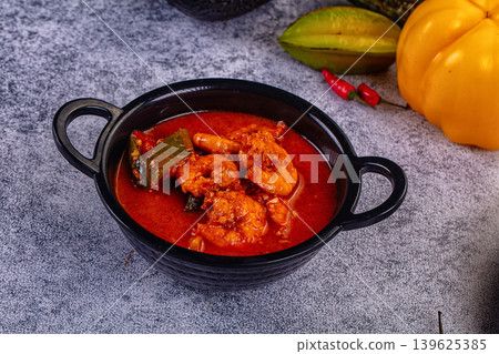 Spicy shrimp soup Red Thai Curry  with prawns and vegetables in a vibrant red broth. Asian cuisine concept. 139625385