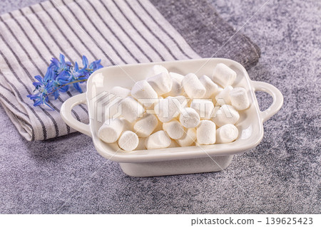 White marshmallows in ceramic bowl, sweet dessert treat, cozy food concept White marshmallows in ceramic bowl, sweet dessert treat, cozy food concept 139625423