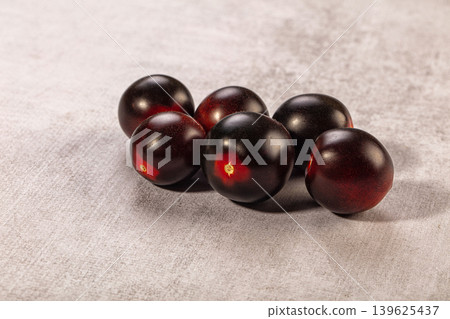 Dark cherry tomatoes, organic purple heirloom produce, fresh healthy food ingredient Dark cherry tomatoes, organic purple heirloom produce, fresh healthy food ingredient 139625437