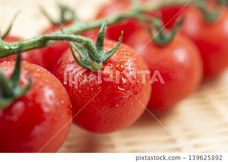 Fresh vegetables, including juicy tomatoes still attached to the vine. Fresh vegetables, including juicy tomatoes still attached to the vine. 139625892