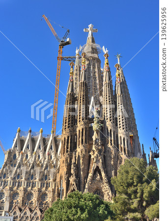 The Sagrada Familia with a cross installed. The Sagrada Familia with a cross installed. 139625956