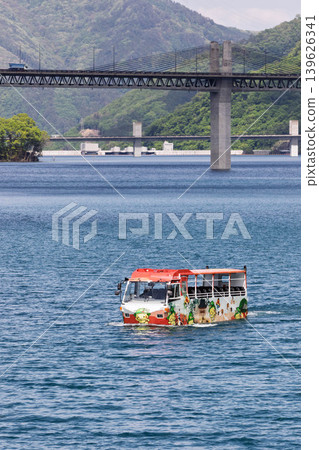 View of Lake Yamba Agatsuma and a water bus from Lake Station Maruiwa. View of Lake Yamba Agatsuma and a water bus from Lake Station Maruiwa. 139626341
