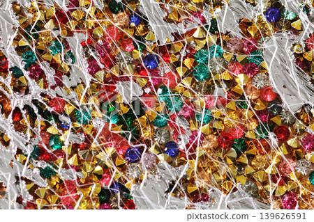 A fantastical glitter background with jewelry-like parts. A fantastical glitter background with jewelry-like parts. 139626591